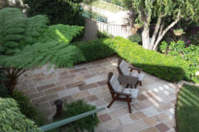 landscaped garden with stone walls